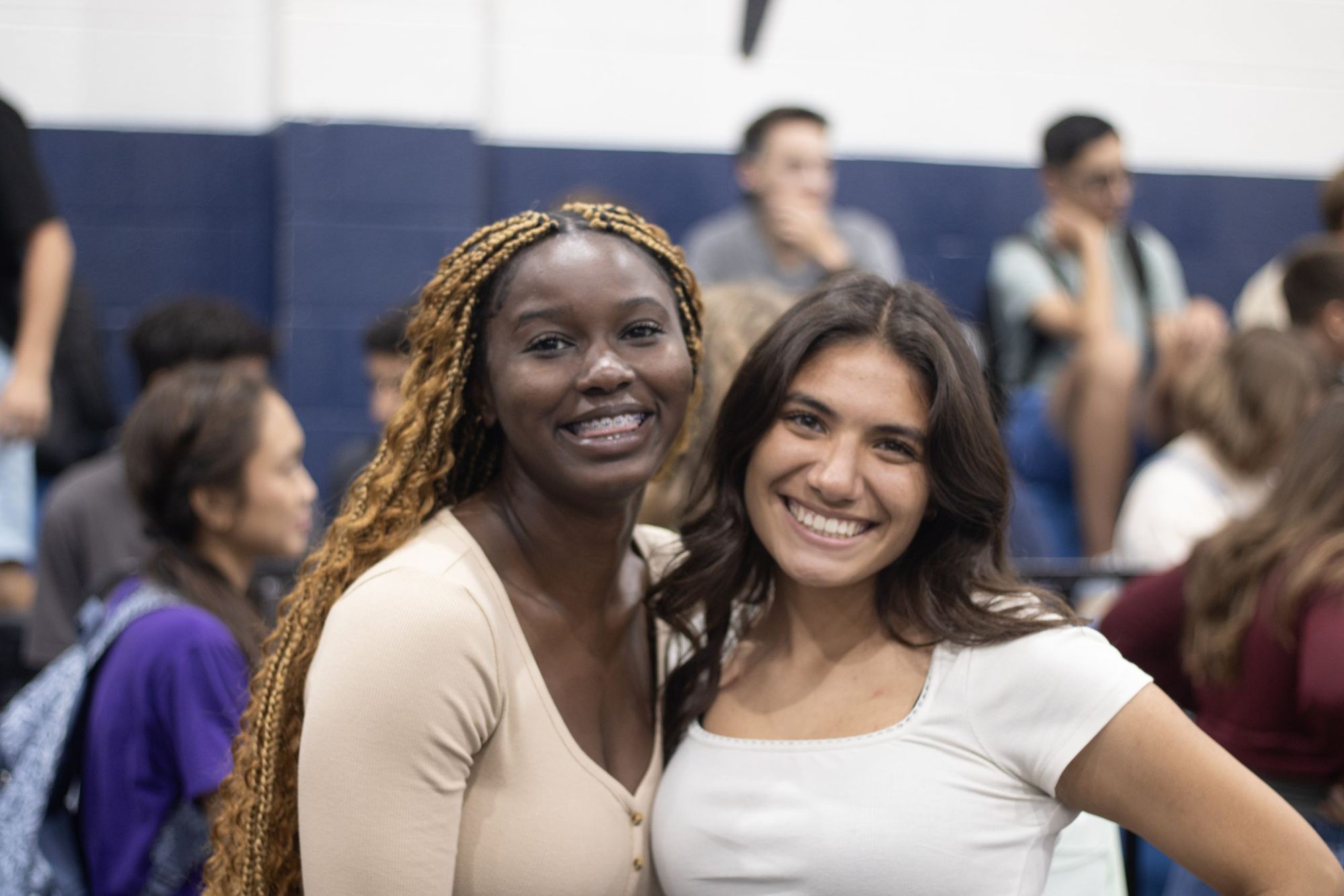 Two Chisholm Trail Academy students smiling in the gym
